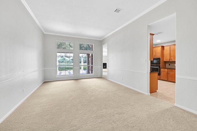 unfurnished living room with crown molding and light carpet