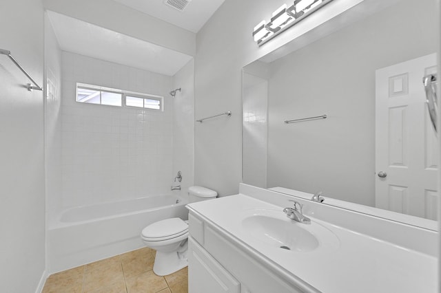 full bathroom featuring tiled shower / bath, vanity, tile patterned floors, and toilet