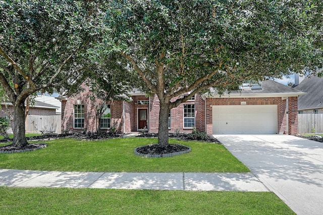 obstructed view of property with a garage and a front yard