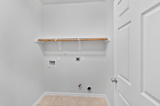 clothes washing area with electric dryer hookup, hookup for a washing machine, hookup for a gas dryer, and light tile patterned floors