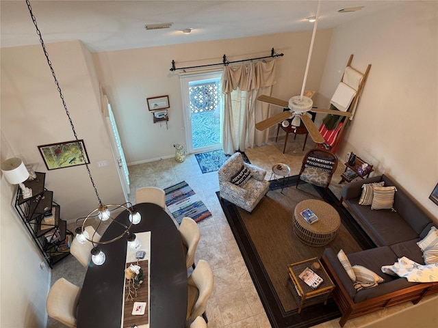 tiled living room featuring ceiling fan