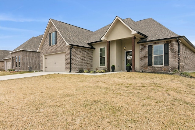 view of front of property featuring a garage and a front yard