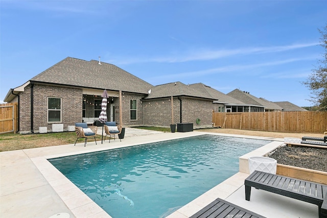 view of swimming pool featuring an outdoor living space and a patio