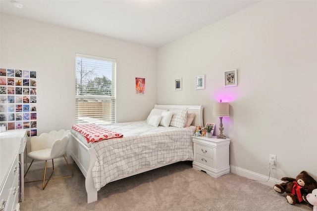 bedroom featuring light colored carpet