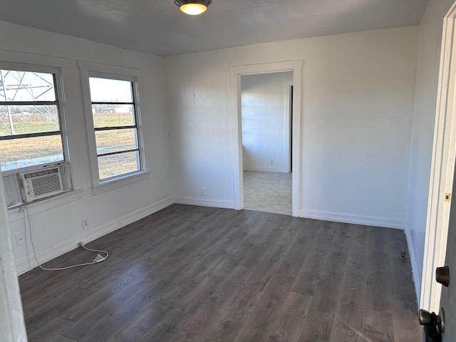 unfurnished room featuring dark wood-type flooring and cooling unit