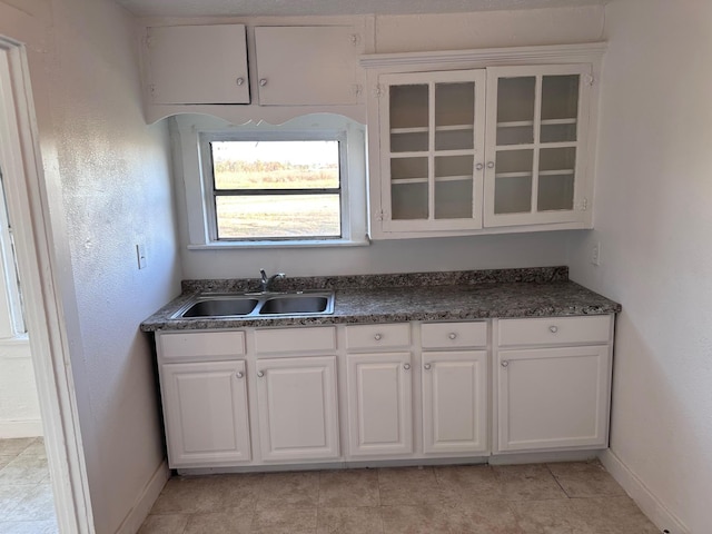 1006 9th St, Galena Park, TX 77547 - kitchen featuring sink and white cabinets