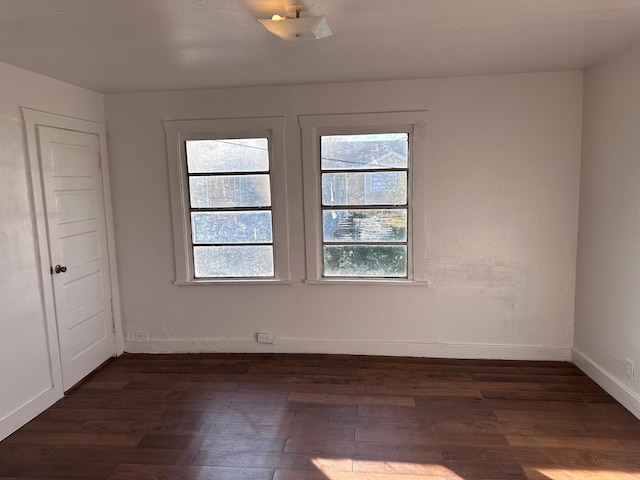 1006 9th St, Galena Park, TX 77547 - unfurnished room featuring dark hardwood / wood-style flooring