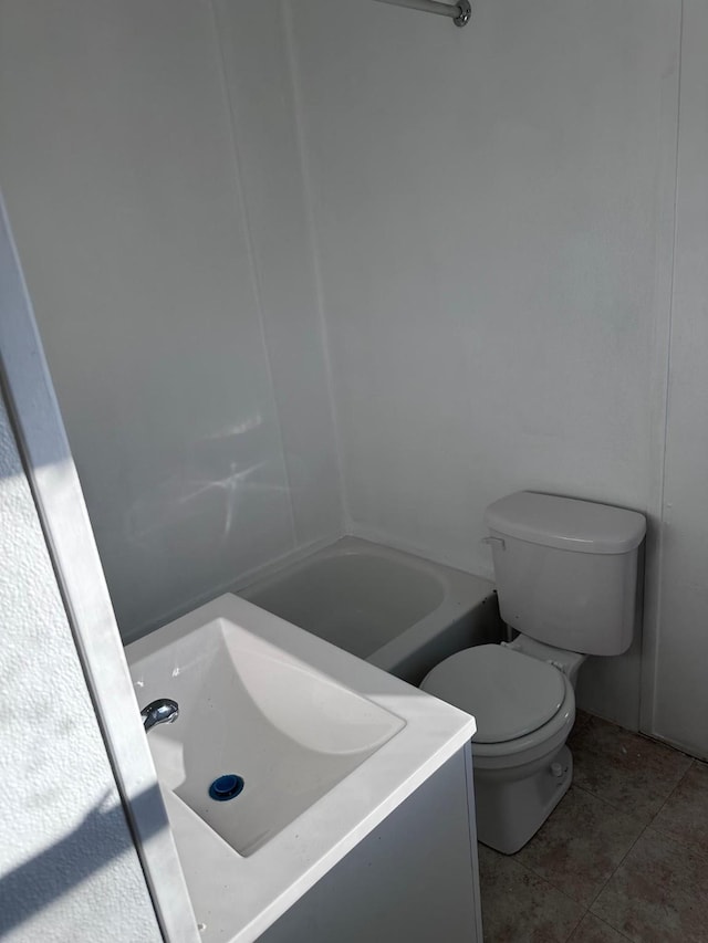 1006 9th St, Galena Park, TX 77547 - bathroom featuring vanity, tile patterned floors, and toilet