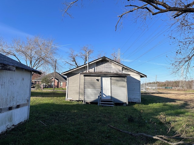 1006 9th St, Galena Park, TX 77547 - view of outbuilding featuring a yard