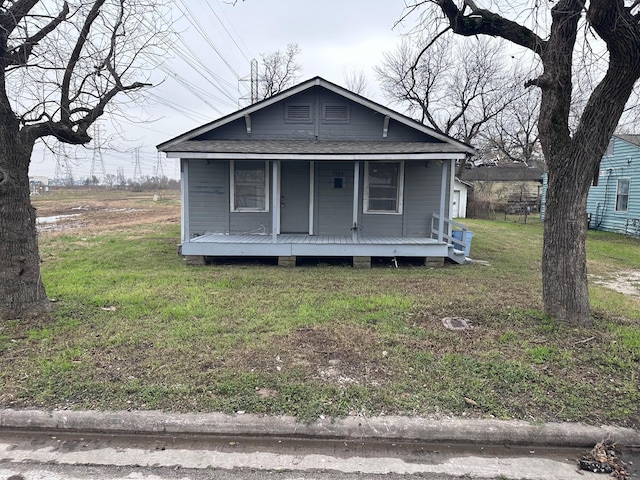 bungalow-style house with a porch and a front yard