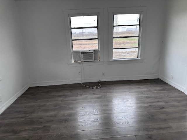 1006 9th St, Galena Park, TX 77547 - empty room featuring dark hardwood / wood-style floors and cooling unit