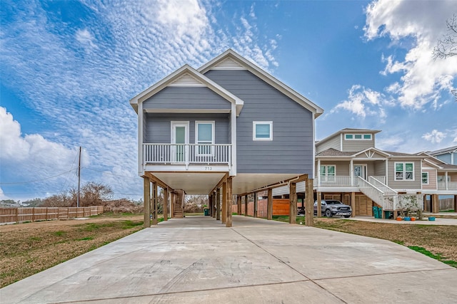 view of front of property featuring a carport and covered porch