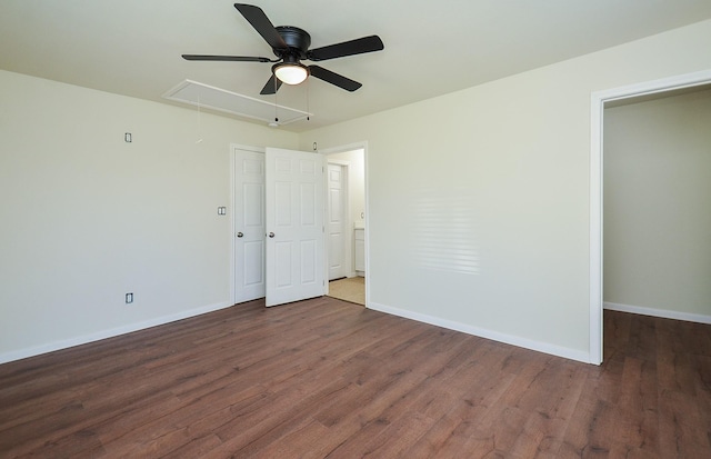 empty room with dark hardwood / wood-style flooring