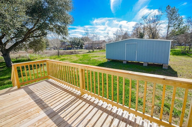 deck with a storage unit and a lawn