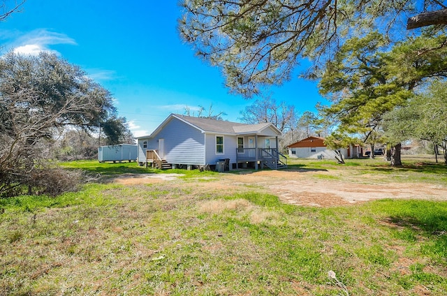 rear view of house with a lawn