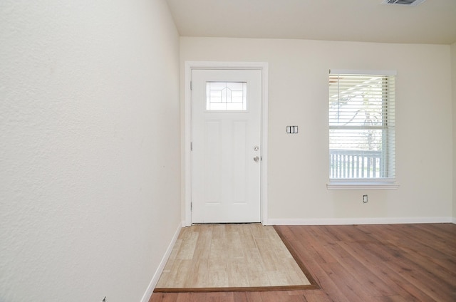 foyer entrance with light hardwood / wood-style flooring