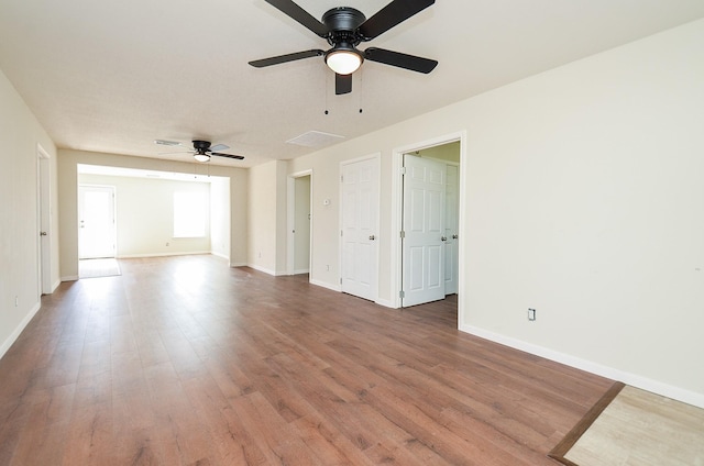 spare room featuring hardwood / wood-style floors and ceiling fan