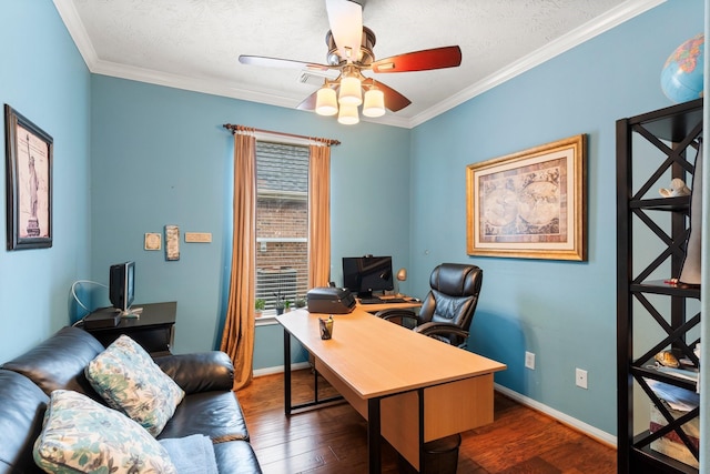 office space featuring crown molding, dark wood-type flooring, a textured ceiling, and ceiling fan