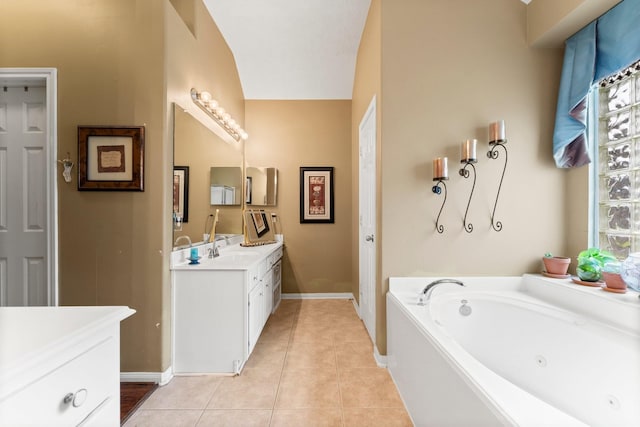 bathroom featuring vanity, a tub, and tile patterned floors