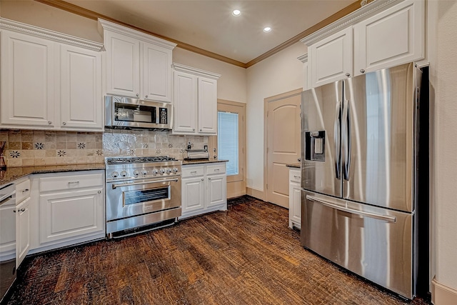 kitchen featuring white cabinetry, ornamental molding, stainless steel appliances, and tasteful backsplash