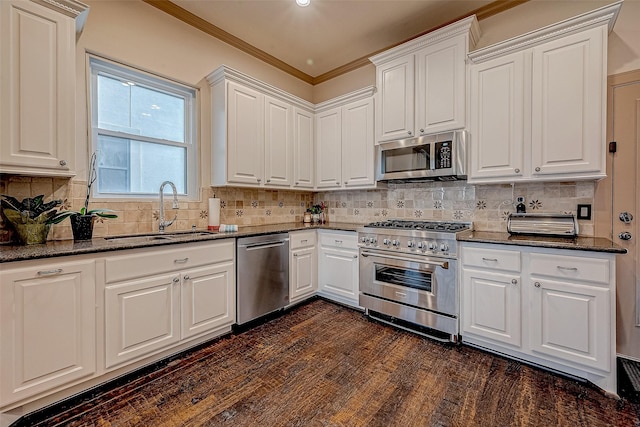 kitchen with sink, appliances with stainless steel finishes, backsplash, dark hardwood / wood-style floors, and white cabinets