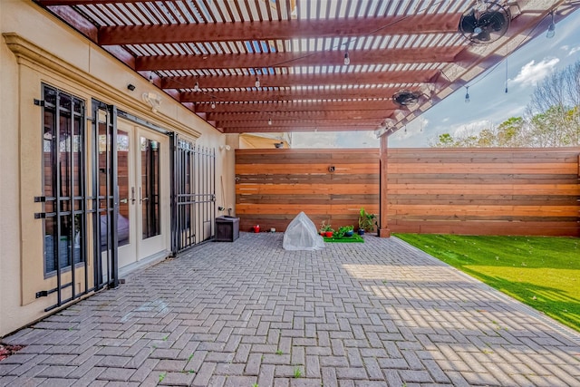 view of patio featuring a pergola and french doors