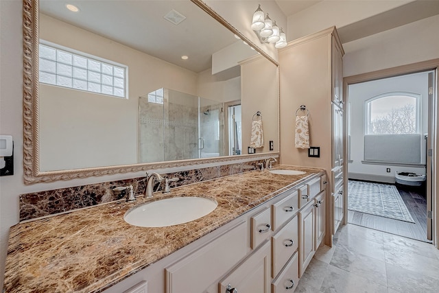 bathroom with vanity and walk in shower