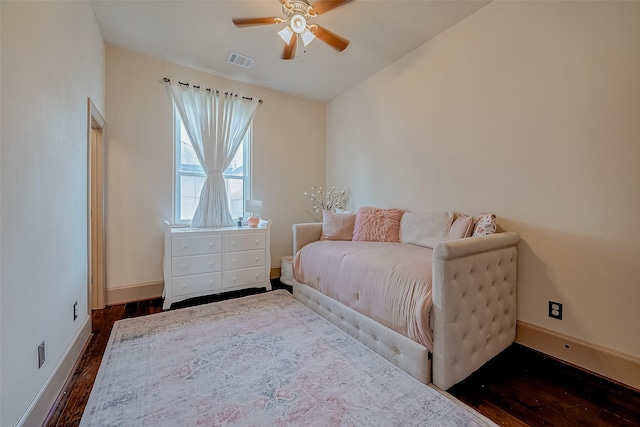 bedroom with dark hardwood / wood-style flooring, lofted ceiling, and ceiling fan