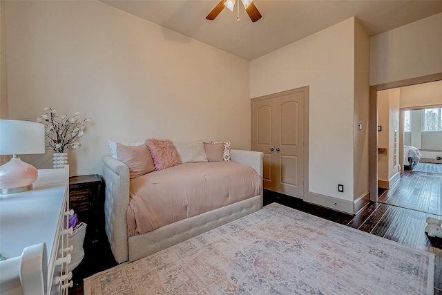 bedroom featuring ceiling fan, lofted ceiling, and dark hardwood / wood-style flooring