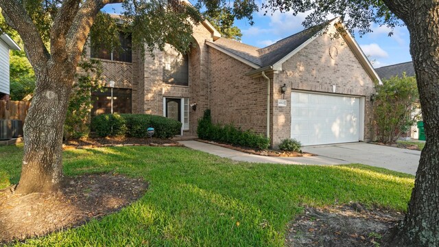 view of front of home featuring a garage and a front yard