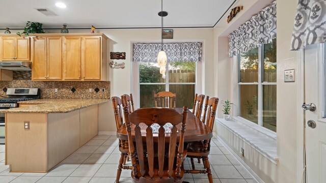 dining area with light tile patterned floors