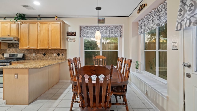 dining room with light tile patterned floors and visible vents