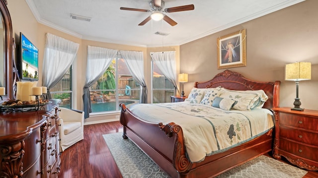 bedroom with visible vents, crown molding, ceiling fan, and wood finished floors