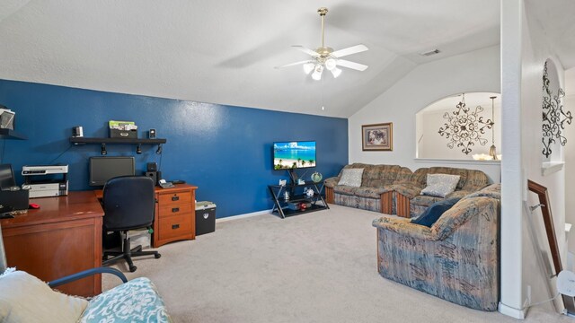 carpeted home office featuring ceiling fan and vaulted ceiling