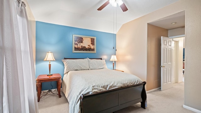 bedroom featuring carpet flooring, baseboards, lofted ceiling, and a ceiling fan