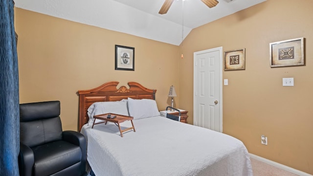 carpeted bedroom featuring baseboards, lofted ceiling, and a ceiling fan