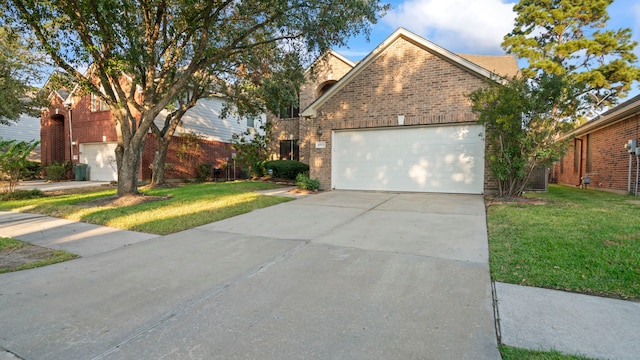 view of front facade with a garage and a front yard