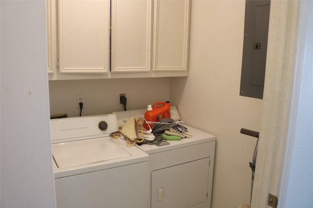 laundry room featuring cabinets, electric panel, and washer and dryer