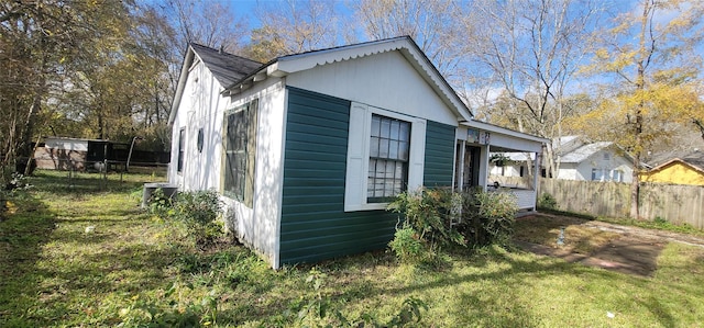 view of home's exterior featuring central AC and a lawn