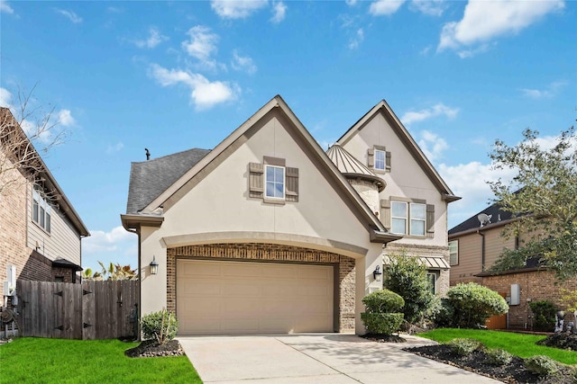 view of front facade featuring a garage and a front lawn