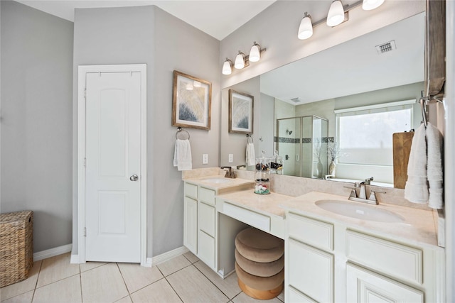 bathroom with tile patterned floors, a shower with door, and vanity