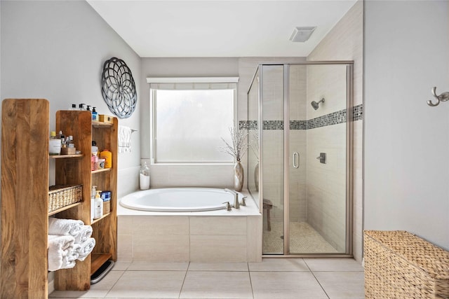 bathroom featuring separate shower and tub and tile patterned floors