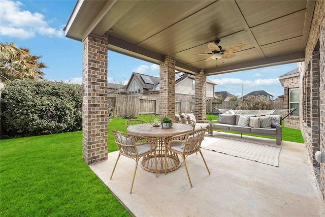 view of patio with an outdoor living space and ceiling fan