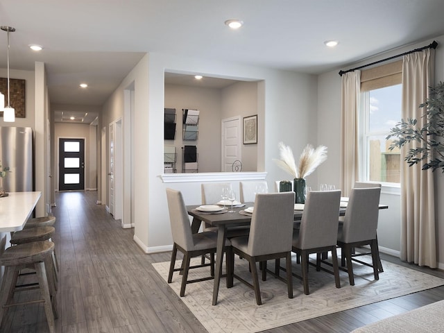 dining space featuring hardwood / wood-style flooring