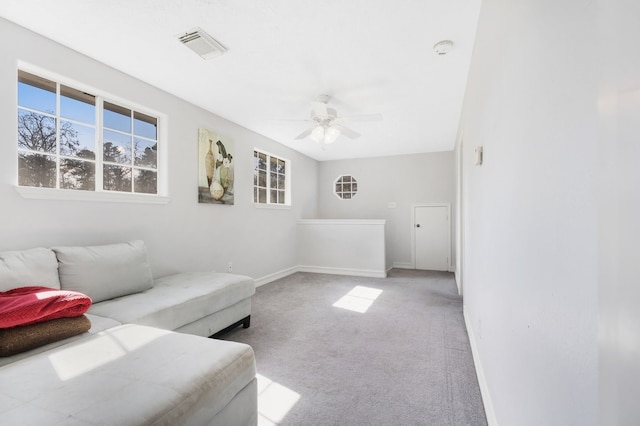 living room featuring light colored carpet and ceiling fan