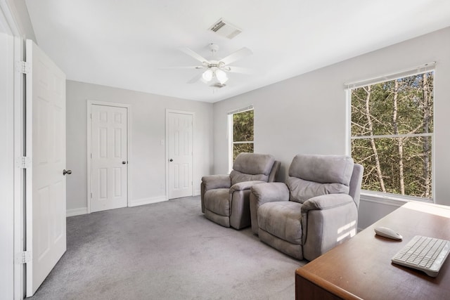 interior space featuring ceiling fan and a healthy amount of sunlight