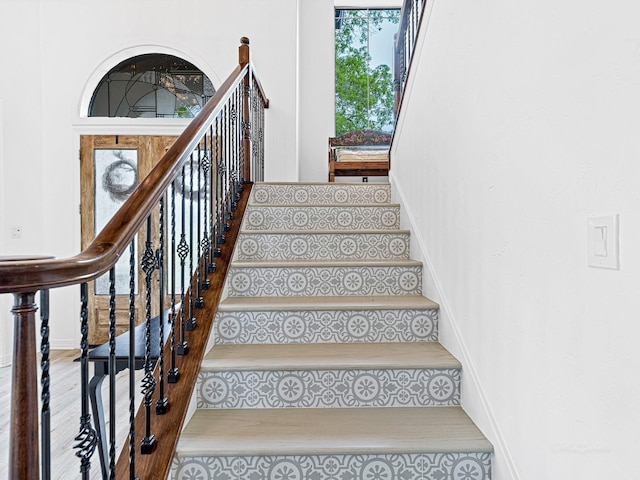 staircase featuring hardwood / wood-style flooring