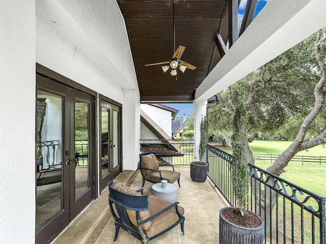 balcony featuring french doors and ceiling fan