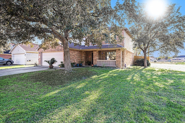 ranch-style house with a porch, a garage, and a front yard