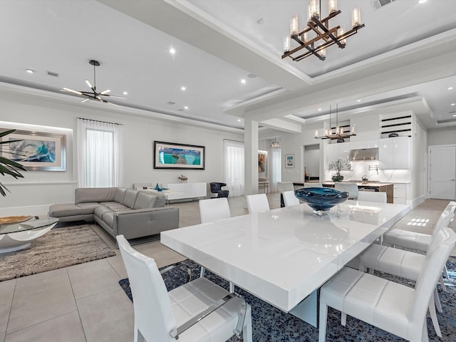 tiled dining area with a raised ceiling, ornamental molding, and an inviting chandelier